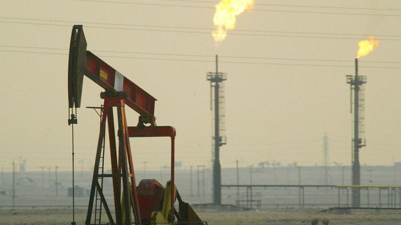A derek pumps in an oil field in Kuwait in 2003