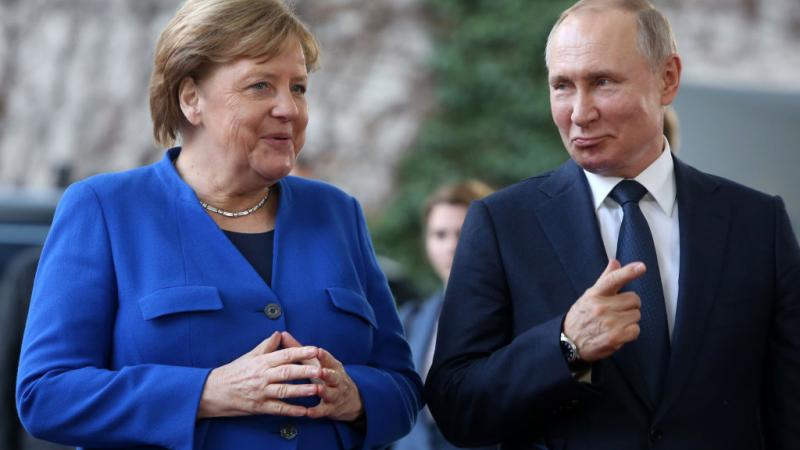 Angela Merkel and Vladimir Putin at international summit on securing peace in Libya in 2020.