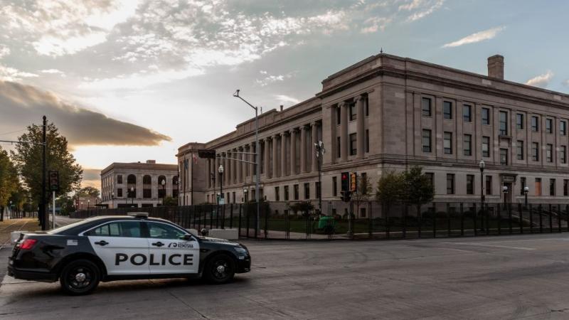 Kenosha Police car driving past Kenosha Courthouse on August 31, 2020