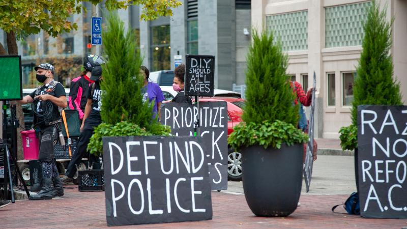 Demonstrators hold up signs in protest at the Hamilton County Courthouse following the Breonna Taylor decision earlier in the day in Louisville, Kentucky, Wednesday, September 23rd, 2020, in Cincinnati, Ohio, United States.