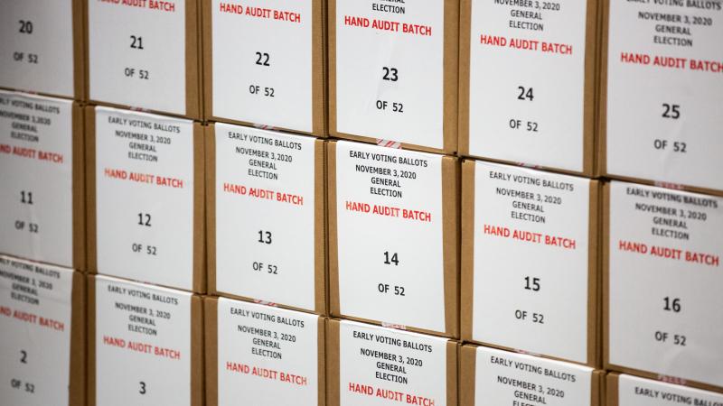 Ballots are pulled aside for a hand audit by Maricopa County Elections Department staff ahead of Tuesdays election on October 31, 2020 in Phoenix, Arizona.