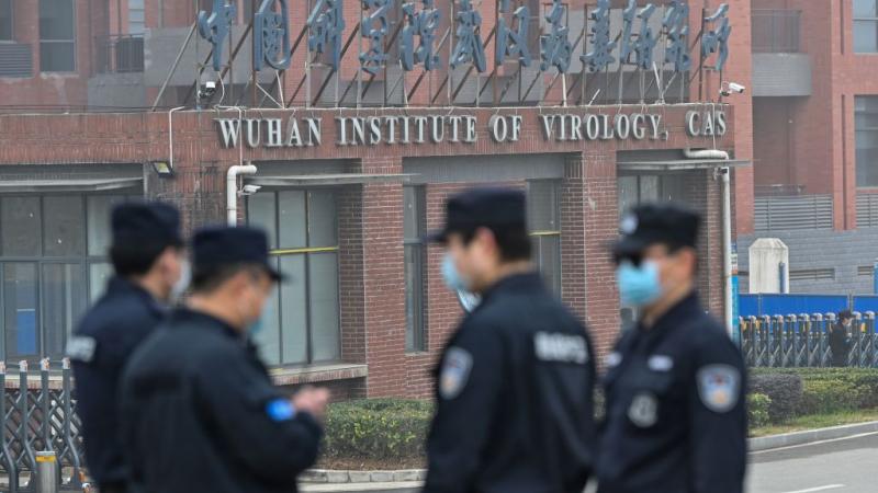 Security personnel outside the Wuhan Institute of Virology in February 2021