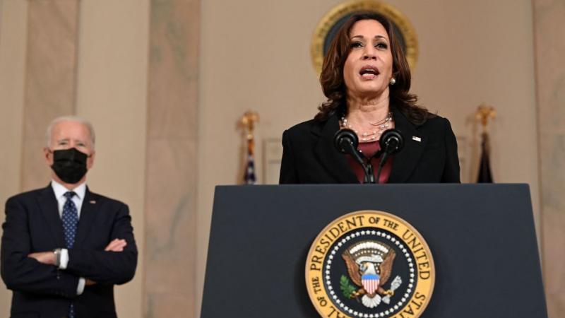 President Biden listens as Vice President Harris speaks on April 20, 2021