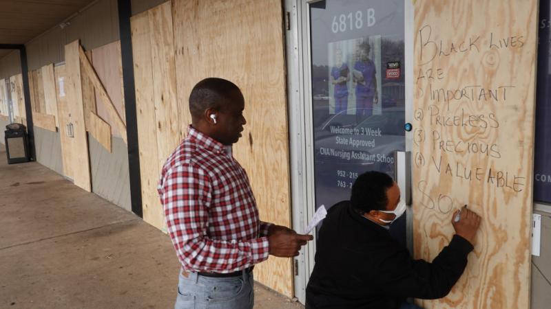 Brooklyn Center, Minn. businesses board up. 