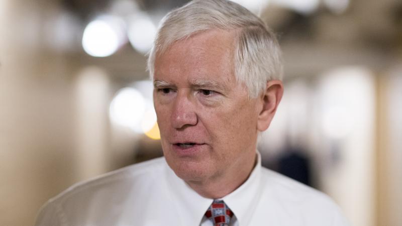 Rep. Mo Brooks, R-Ala., speaks with reporters as he leaves the House Republican Conference meeting in the Capitol on Wednesday morning, Sept. 7, 2016.