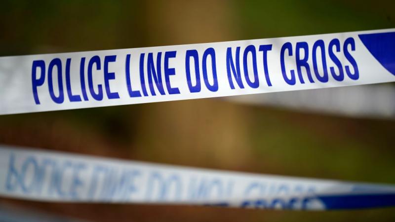 Police cordon around the scene of a house fire in England in 2019