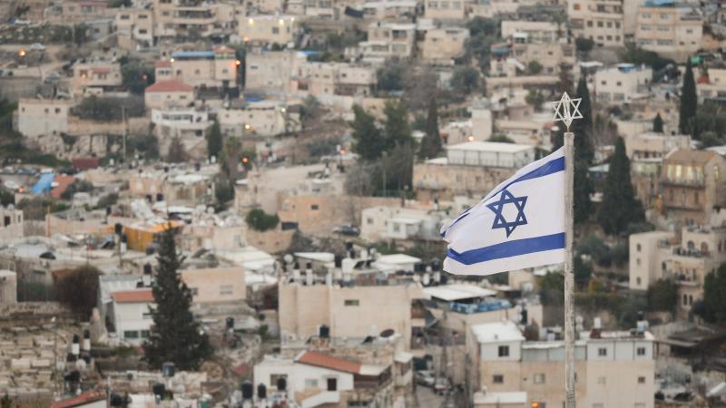 An Israeli national flag seen from Mount of Olives in Jerusalem. On Tuesday, February 4, 2020, in Jerusalem, Israel.