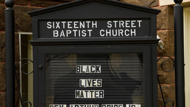 A sign reads "Black Lives Matter" at the 16th Street Baptist Church, a Civil Rights historical site where four young girls were killed in a Ku Klux Klan (KKK) bombing in 1953, on March 27, 2021 in Birmingham, Alabama.