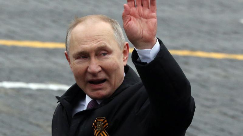 Russian President Vladimir Putin waves on May 9, 2021