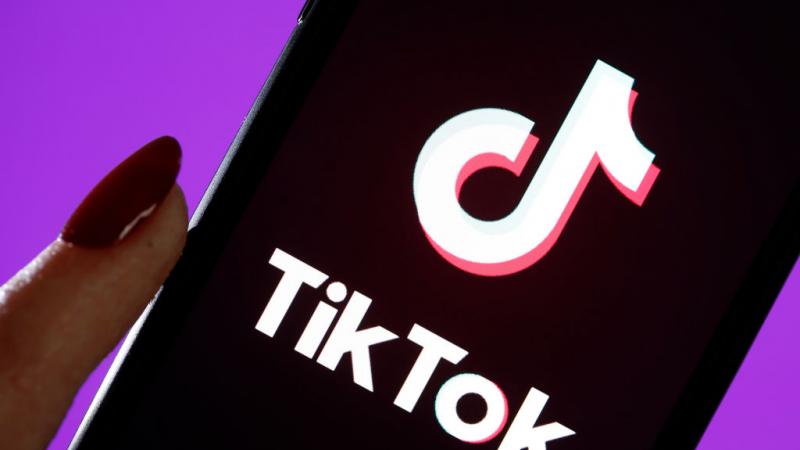 Photo illustration of TikTok logo on iPhone screen