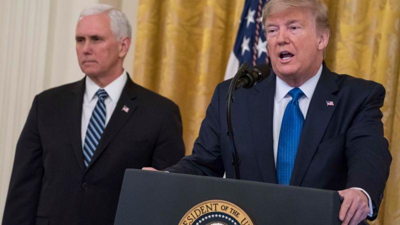 President Trump speaks as Vice President Pence looks on in January 2020