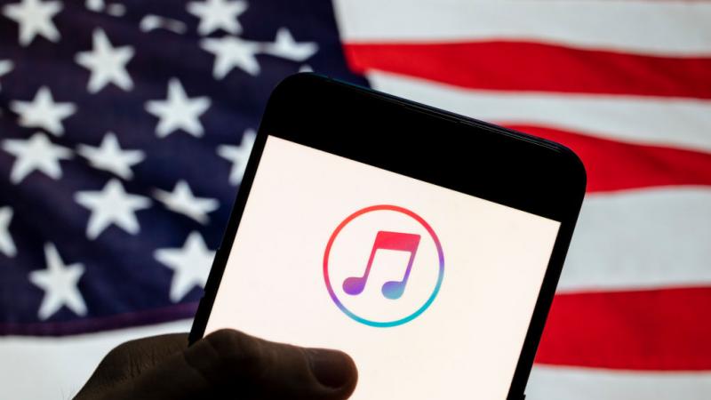 ITunes logo in front of flag