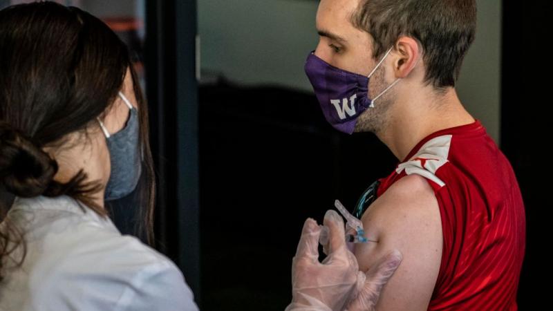 Student gets vaccinated for a free burger
