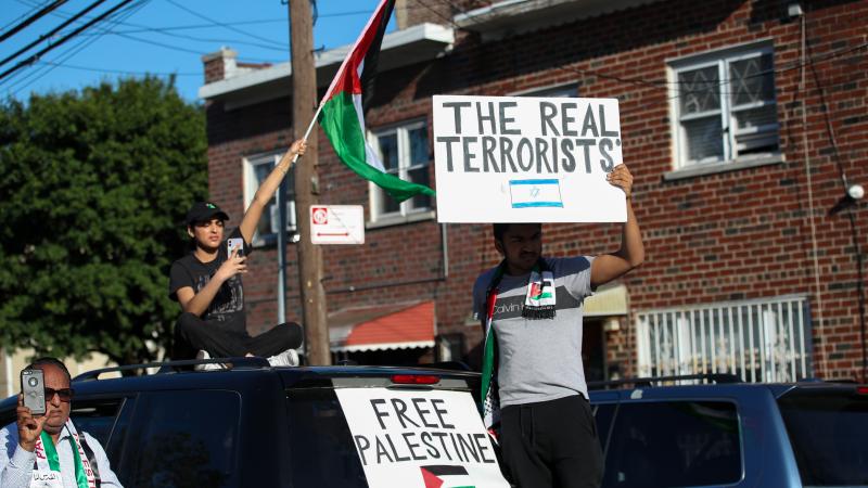 Hundreds holding banners and Palestinian flags gather at the Little Yemen district of Bronx and take streets to protest Israeli aggression against Palestinians, in New York City, United States on May 31, 2021.