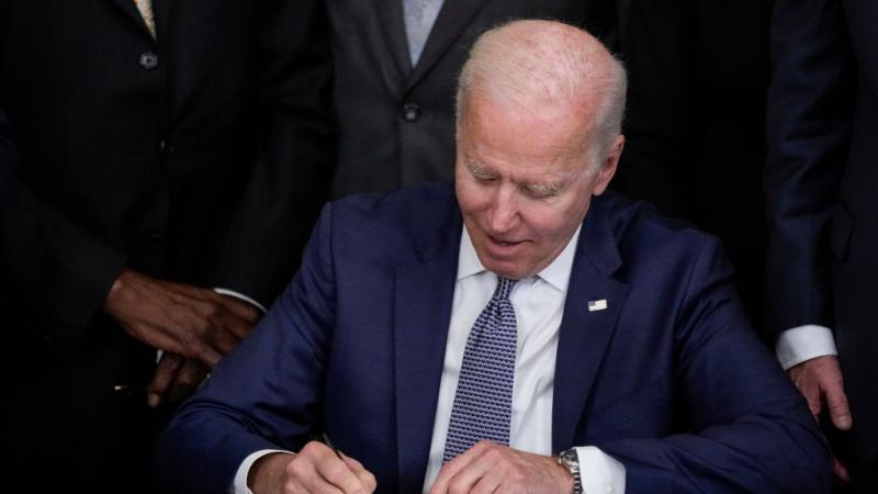 President Biden signs the Juneteenth National Independence Day Act into law on June 17, 2021