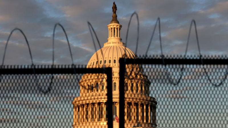 U.S. Capitol behind fence with razor wire on Jan. 16, 2021
