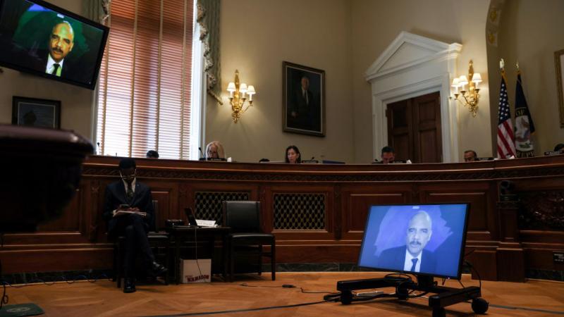 Eric Holder testifying on June 24