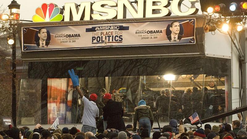 Crowd gathers around MSNBC mobile studio the day before Barack Obama's inauguration