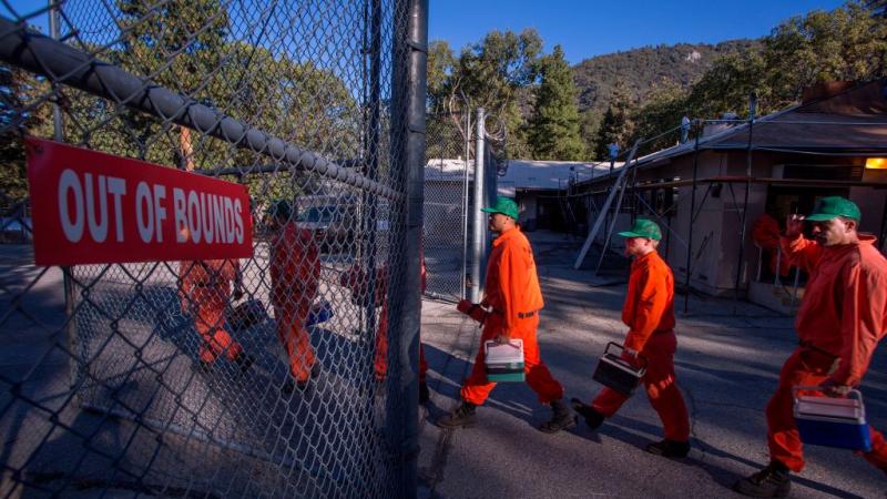 Prisoners at Oak Glen Conservation Camp go help fight a CA fire.