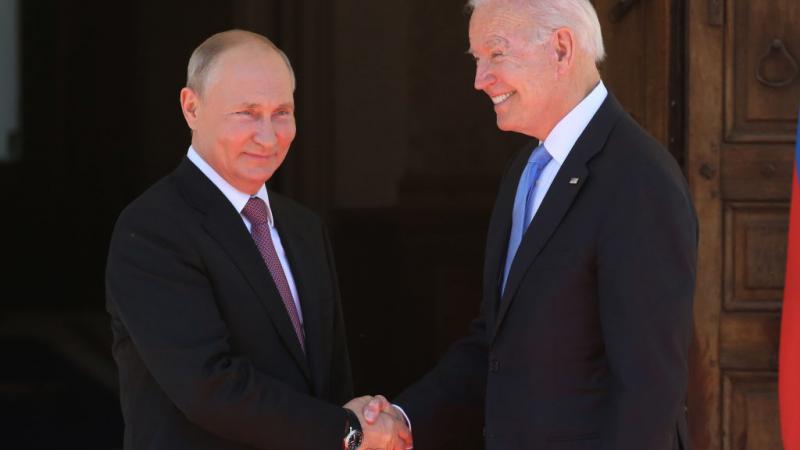 President Joe Biden shakes hands with Russian President Vladimir Putin.