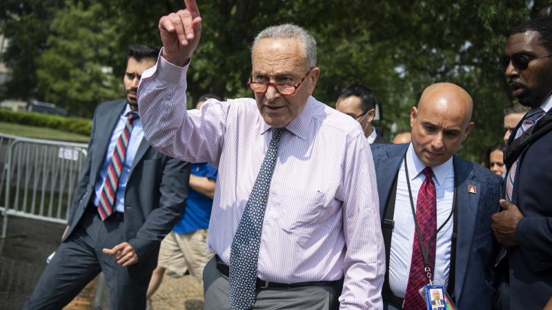 Senate Majority Leader Charles Schumer, D-N.Y., leaves a news conference on immigration outside the Capitol while the senate conducted a procedural vote on the infrastructure bill on Wednesday, July 21, 2021.