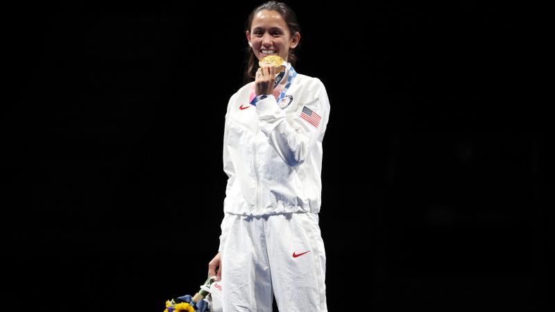 Gold medalist Lee Kiefer of Team United States poses on the podium during the medal ceremony for the Women's Foil Individual Fencing Gold Medal event on day two of the Tokyo 2020 Olympic Games at Makuhari Messe Hall on July 25, 2021 in Chiba, Japan.