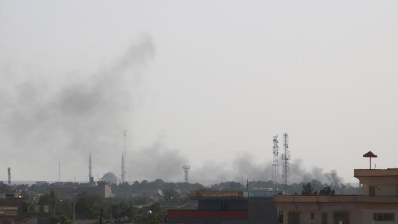 Photo taken on Aug. 6, 2021 shows smoke rising during gun fights in Shiberghan, capital of Jawzjan Province, Afghanistan.