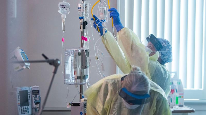 Nurses care for a Covid-19 patient inside the ICU (intensive care unit) at Adventist Health in Sonora, California on August 27, 2021.