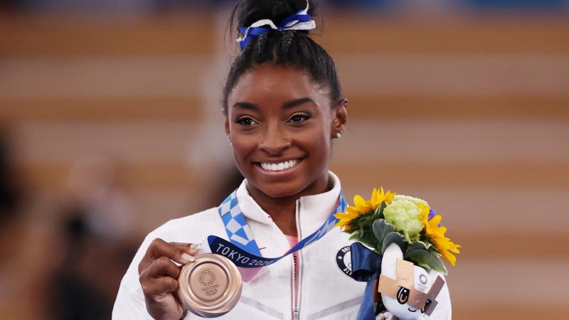 Simone Biles of Team United States poses with the bronze medal during the Women's Balance Beam Final medal ceremony on day eleven of the Tokyo 2020 Olympic Games at Ariake Gymnastics Centre on August 03, 2021 in Tokyo, Japan.