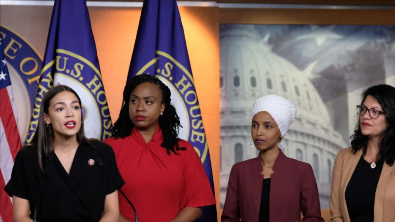 U.S. Rep. Alexandria Ocasio-Cortez (D-NY) speaks as Reps. Ayanna Pressley (D-MA), Ilhan Omar (D-MN), and Rashida Tlaib (D-MI) at a press conference