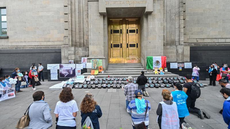 Catholic anti-abortion activists pray during a protest outside the Mexican Supreme Court building in Mexico City, on July 29, 2020, amid the novel coronavirus pandemic.