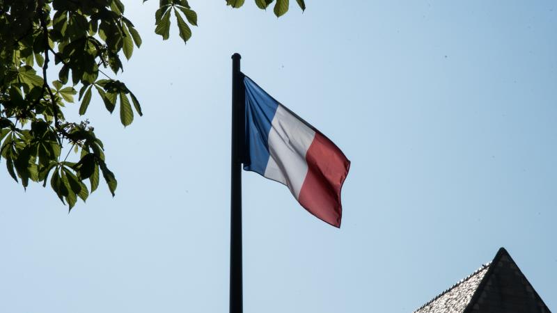 The French flag on the roof of the Conservatoire National des Arts et Métiers