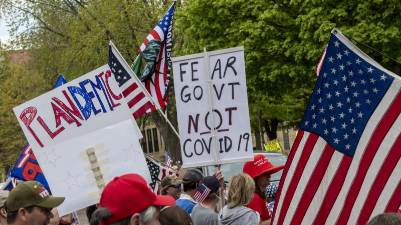 Protest at Governor Tim Walz's mansion to reopen Minnesota, Plandemic sign.