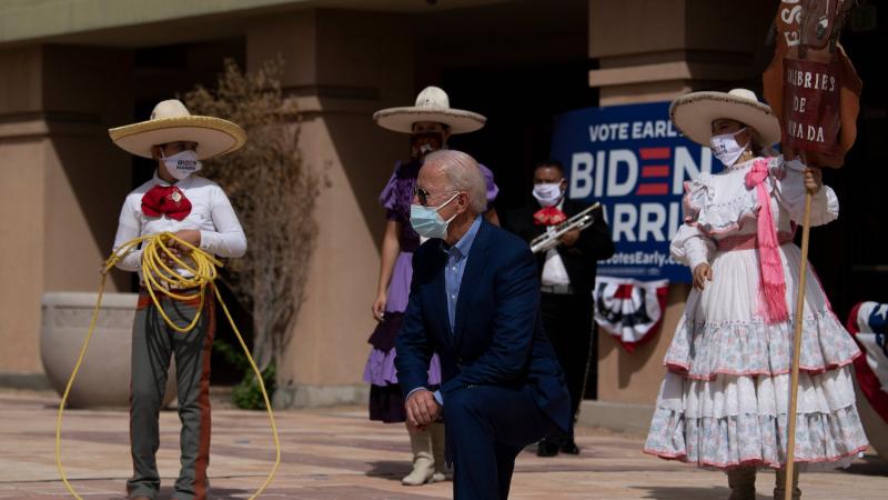 Joe Biden poses with supporters after speaking at the East Las Vegas Community Center about the effects of Covid-19 on Latinos, October 9, 2020, in Las Vegas, Nevada.