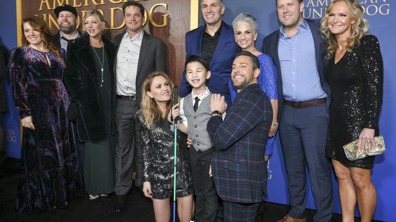 Catherine Downes, Kevin Downes, Anna Paquin, Hayden Zaller, Kurt Warner, Brenda Warner, Zachary Levi, Jon Erwin, and Beth Erwin attend the Los Angeles premiere of Lionsgate's "American Underdog" at TCL Chinese Theatre on December 15, 2021 in Hollywood, California.