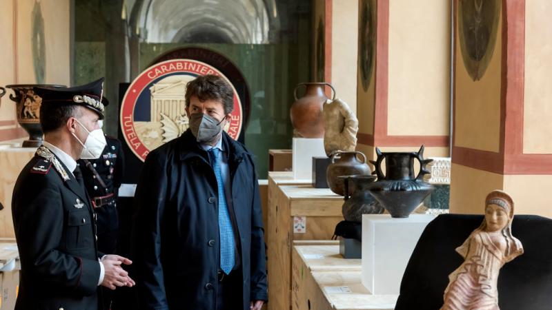 Italian Minister of Culture Dario Franceschini surveys a selection of recovered artifacts, Dec. 30