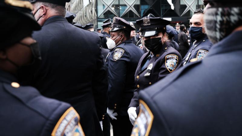 olice officers gather for the funeral of fallen NYPD officer Wilbert Mora at St. Patrick's Cathedral on February 02, 2022 in New York City