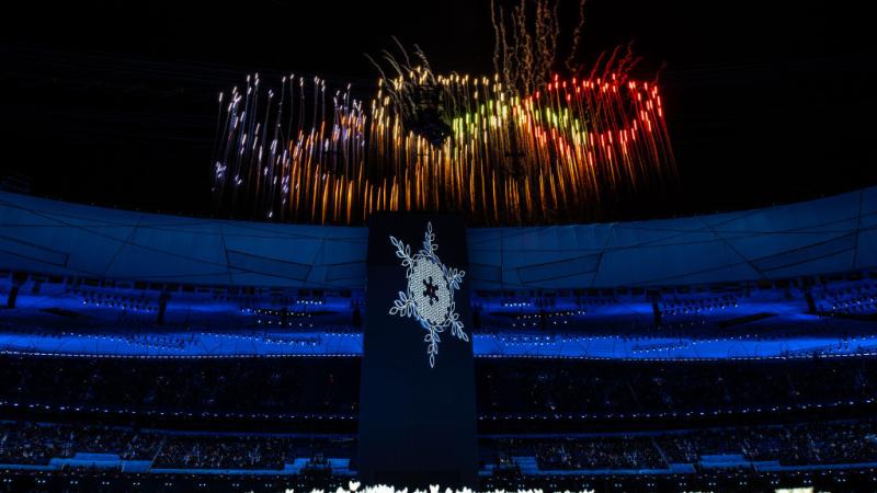 General View inside the stadium of the Olympic Cauldron as a firework display is seen above during the Opening Ceremony of the Beijing 2022 Winter Olympics