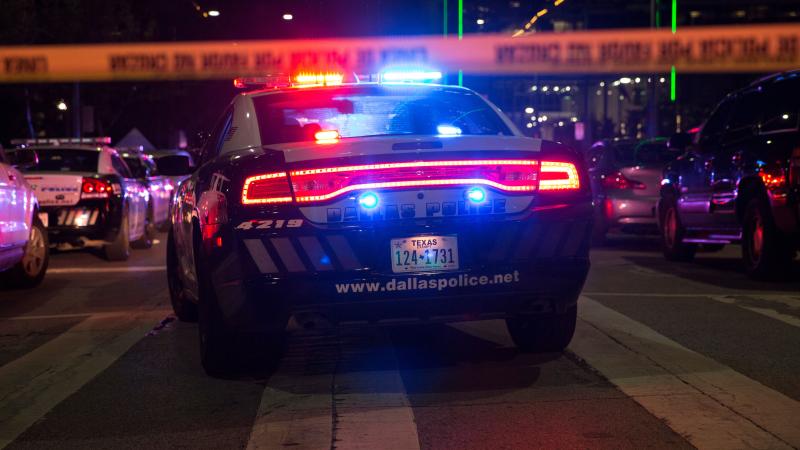 Police cars sit on Main Street in Dallas following the sniper shooting during a protest on July 7, 2016.