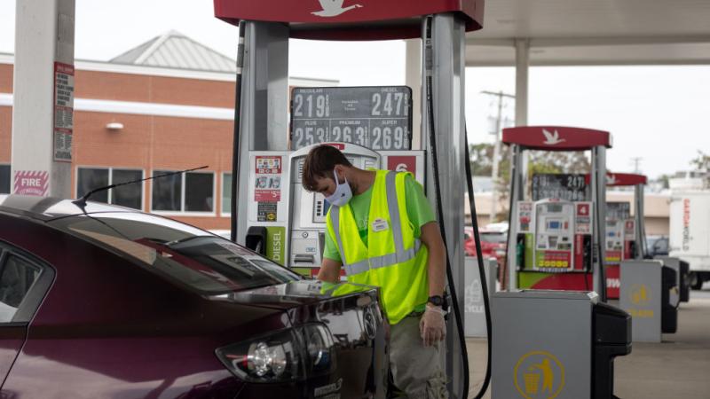 An attendant pumps gas in Somers Point, N.J., Aug. 2020