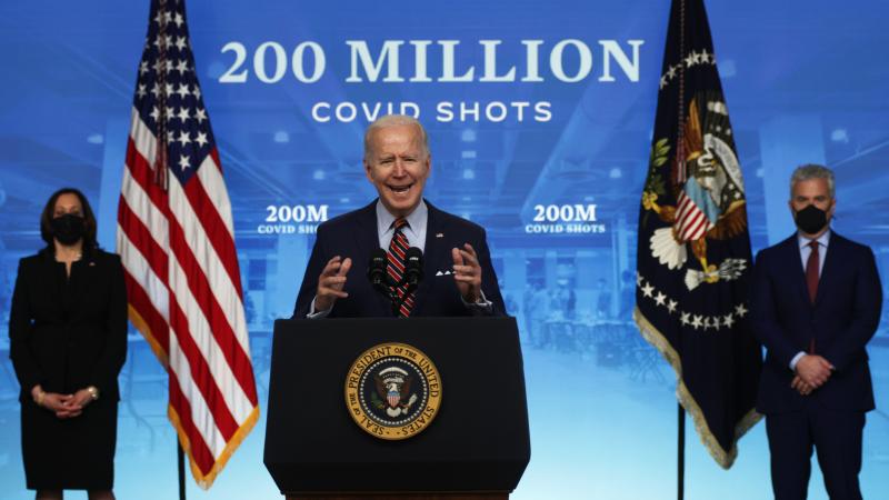 U.S. President Joe Biden (2nd L) delivers remarks on the COVID-19 response and the state of vaccinations as Vice President Kamala Harris (L) and Coronavirus Response Coordinator Jeffrey Zients (R) look on at the South Court Auditorium of Eisenhower Executive Office Building