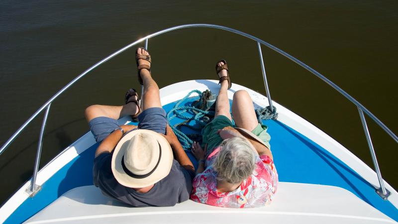 Passengers on river cruise, Norfolk, U.K.