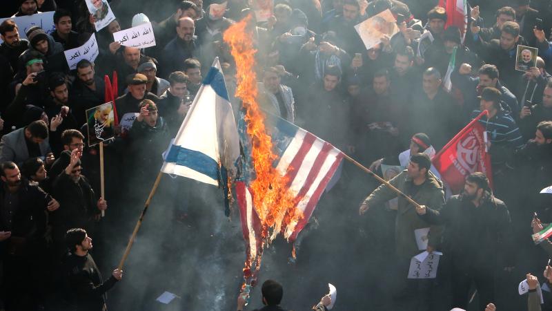 Iranians burn U.S. and Israeli flags, Tehran, Jan. 6, 2020