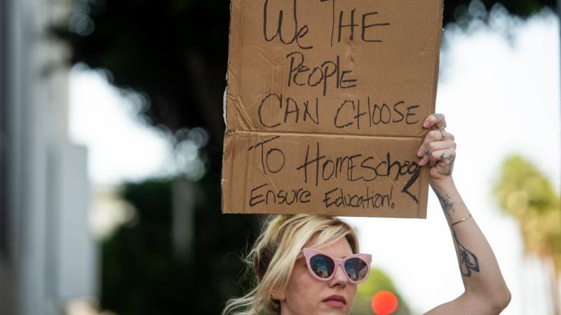 A pro-homeschool protester in Los Angeles, Sept. 2021
