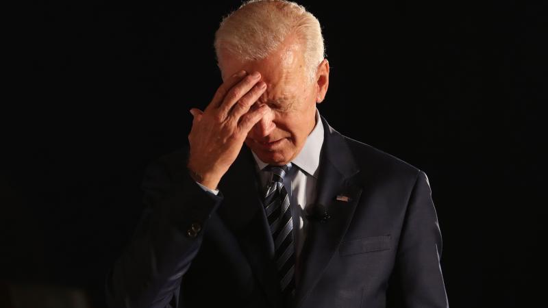 Joe Biden hand on forehead