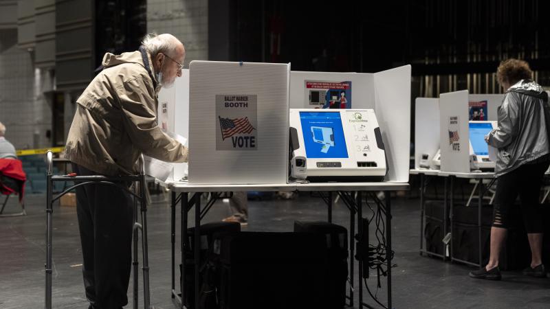 Voters cast their ballots in the Ohio primary election at a polling location at Worthington Kilbourne High School on May 3, 2022 in Worthington, Ohio, a suburb of Columbus
