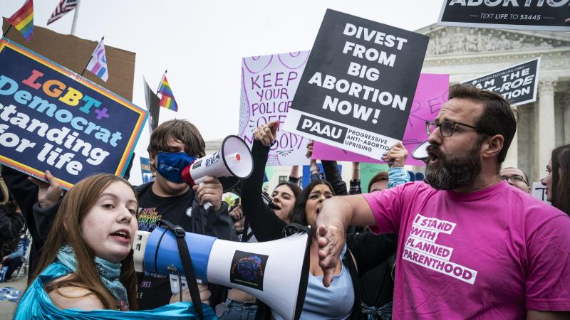 Abortion rights advocates and antiabortion advocates demonstrate outside the Supreme Court after a leak of a draft majority opinion overturning abortion rights, on Capitol Hill on Tuesday, May 03, 2022 in Washington, DC.