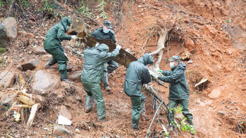 Rescuers work at the site of a plane crash on March 23, 2022 in Tengxian County, Wuzhou City, Guangxi Zhuang Autonomous Region of China