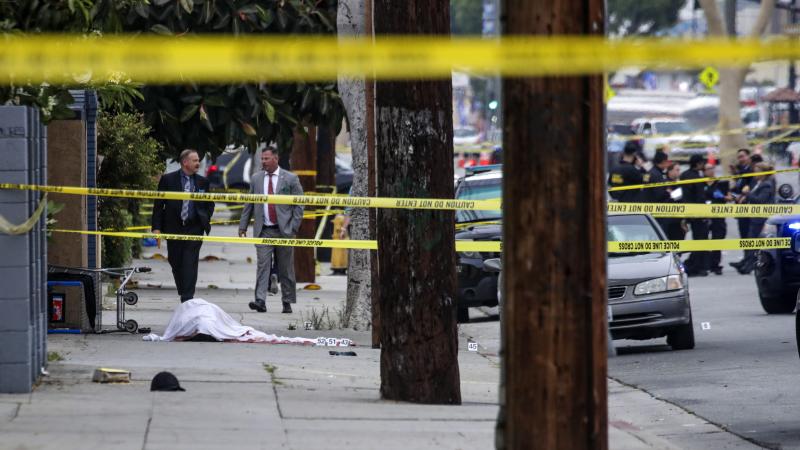 Detectives, police officers at crime scene, June 15, 2022, El Monte, Calif.