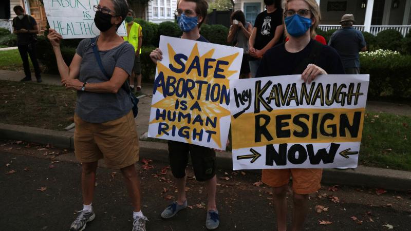 Pro-choice activists protest outside the house of U.S. Supreme Court Associate Justice Brett Kavanaugh September 13, 2021 in Chevy Chase, Maryland.